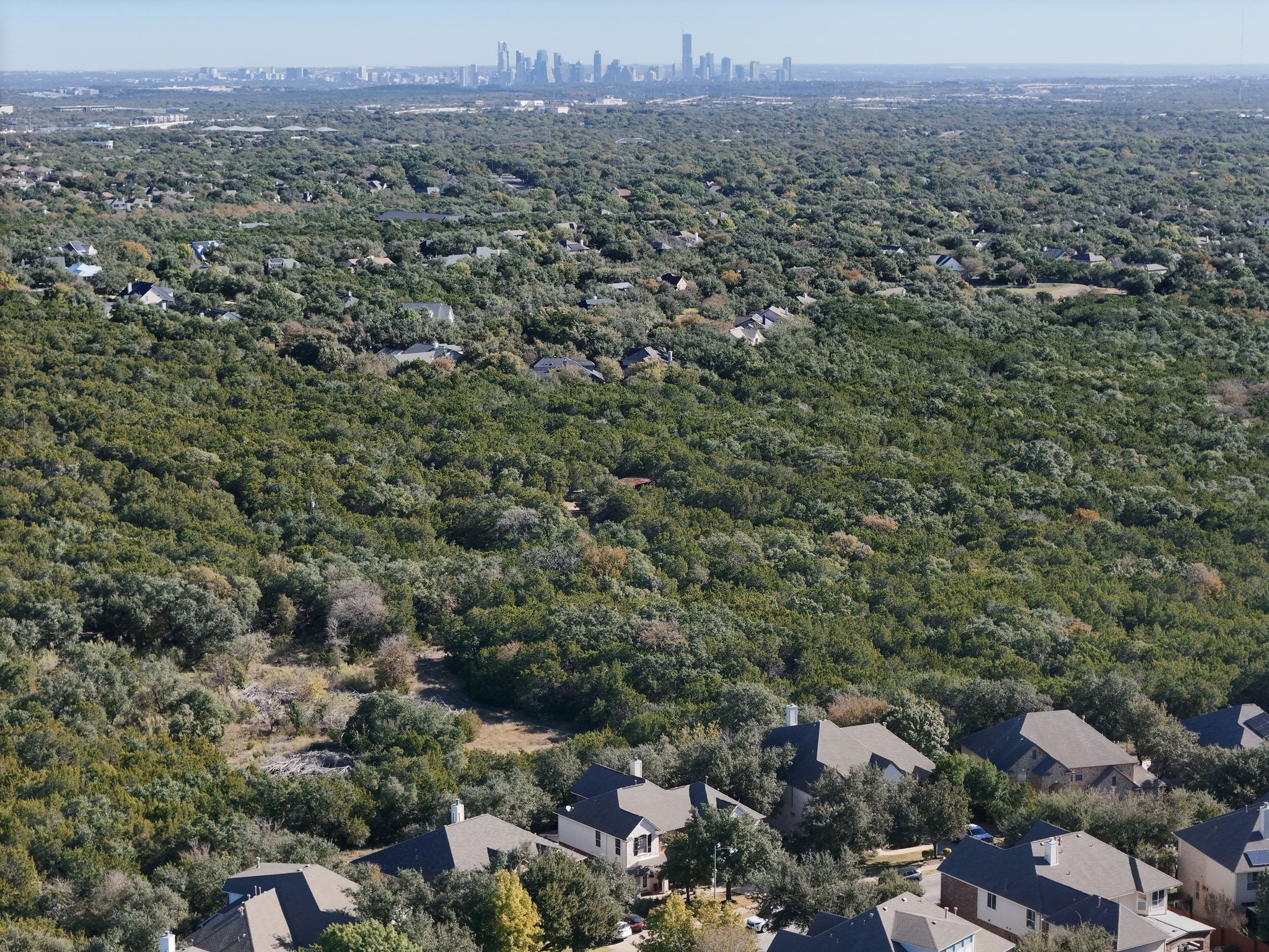 7112 Via Correto Drive Austin, TX 78749 - Photo 26 of 29 Bird's-eye view of the surrounding greenbelt from the backyard of the home