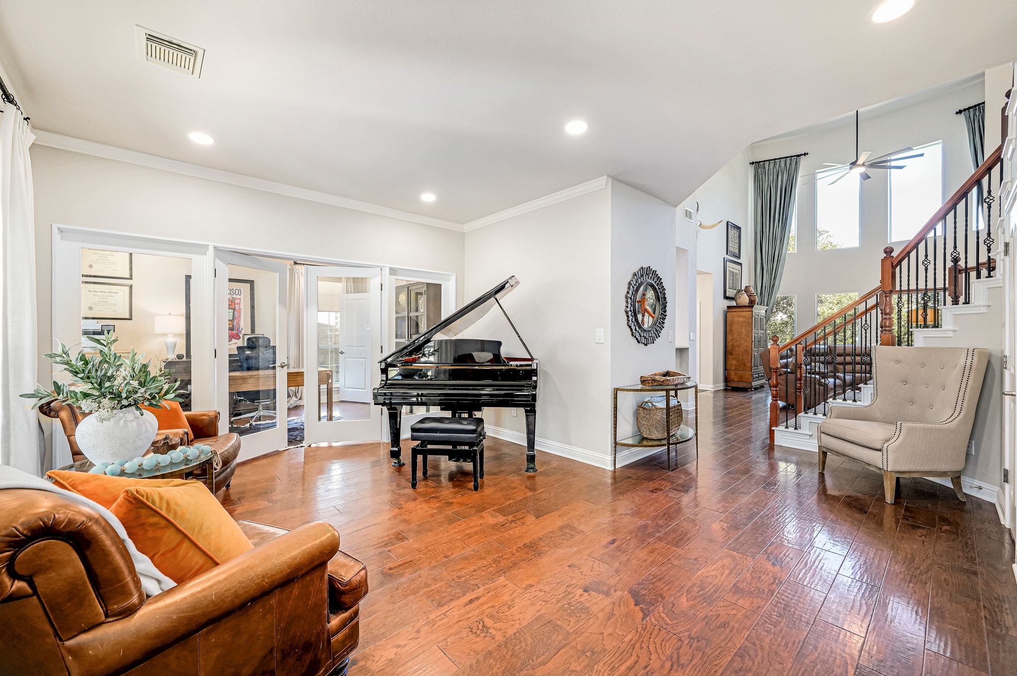 7112 Via Correto Drive Austin, TX 78749 - Photo 9 of 29 Sitting with french doors, hardwood / wood flooring, crown molding, healthy amount of natural light, and recessed lighting