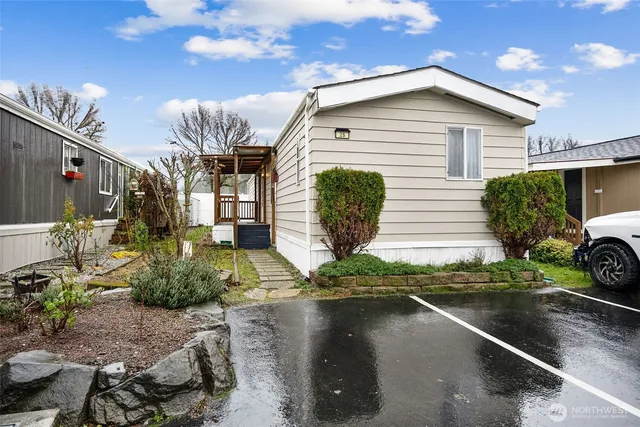 a front view of a house with garden