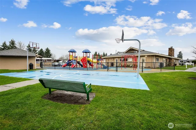 a view of a park with swings and slides