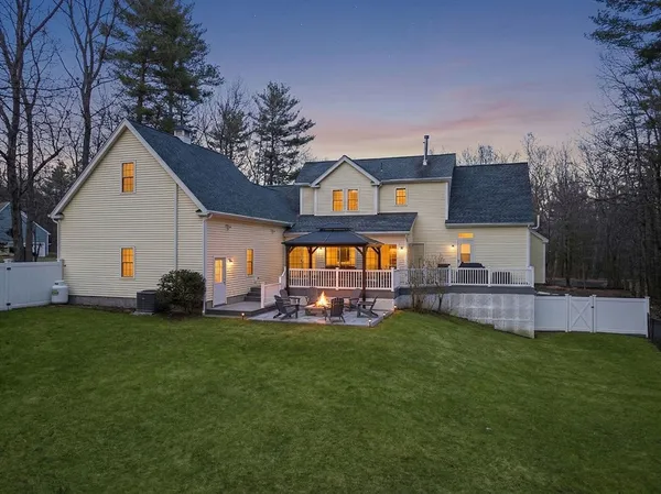a front view of house with a garden