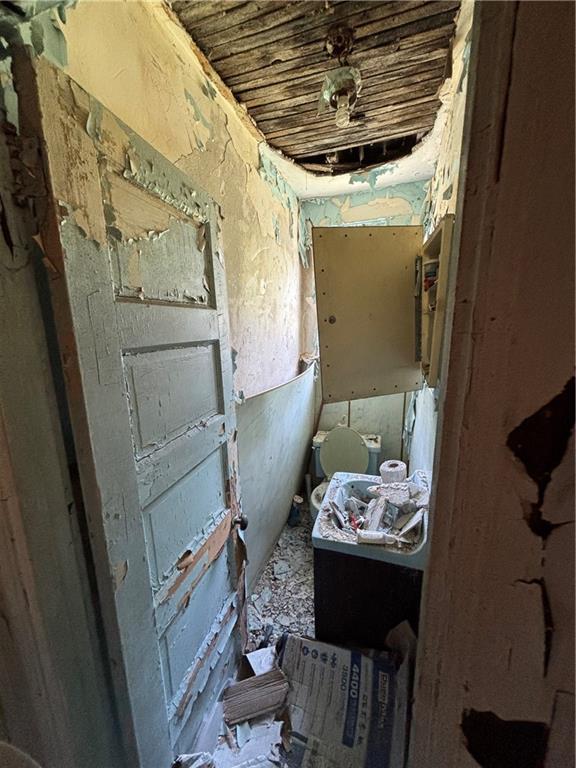 3326 Ruthven Street Pittsburgh, PA 15219 - Photo 14 of 17 a bathroom with a sink and a mirror