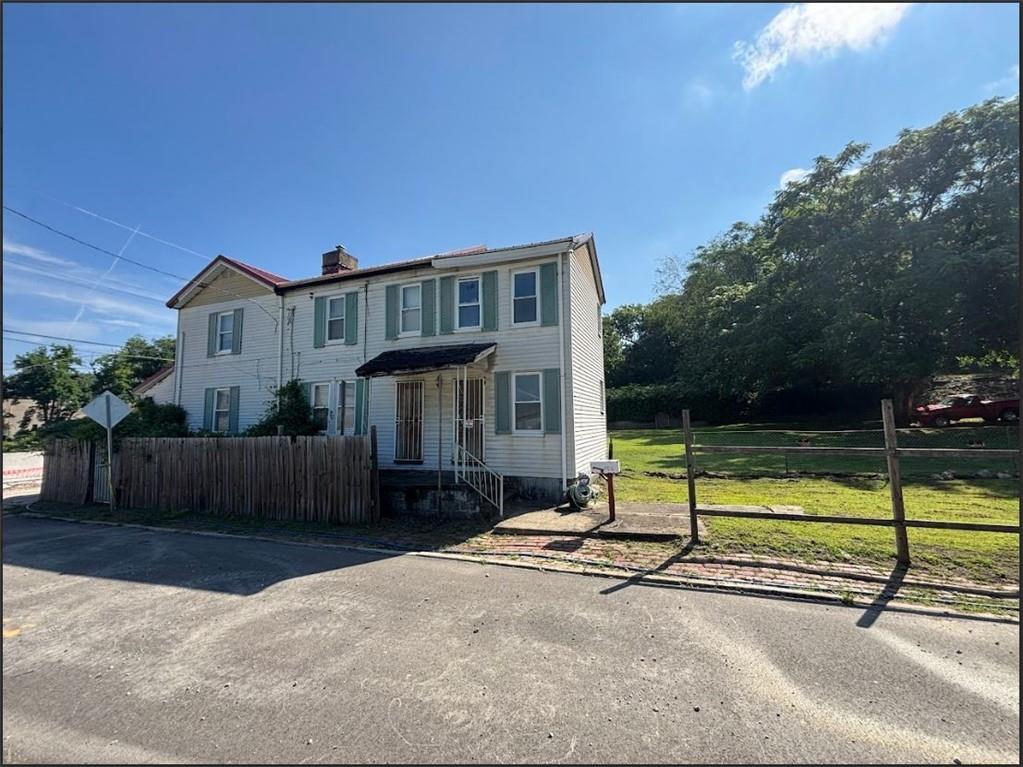 3326 Ruthven Street Pittsburgh, PA 15219 - Photo 2 of 17 a view of a house with backyard and a tree