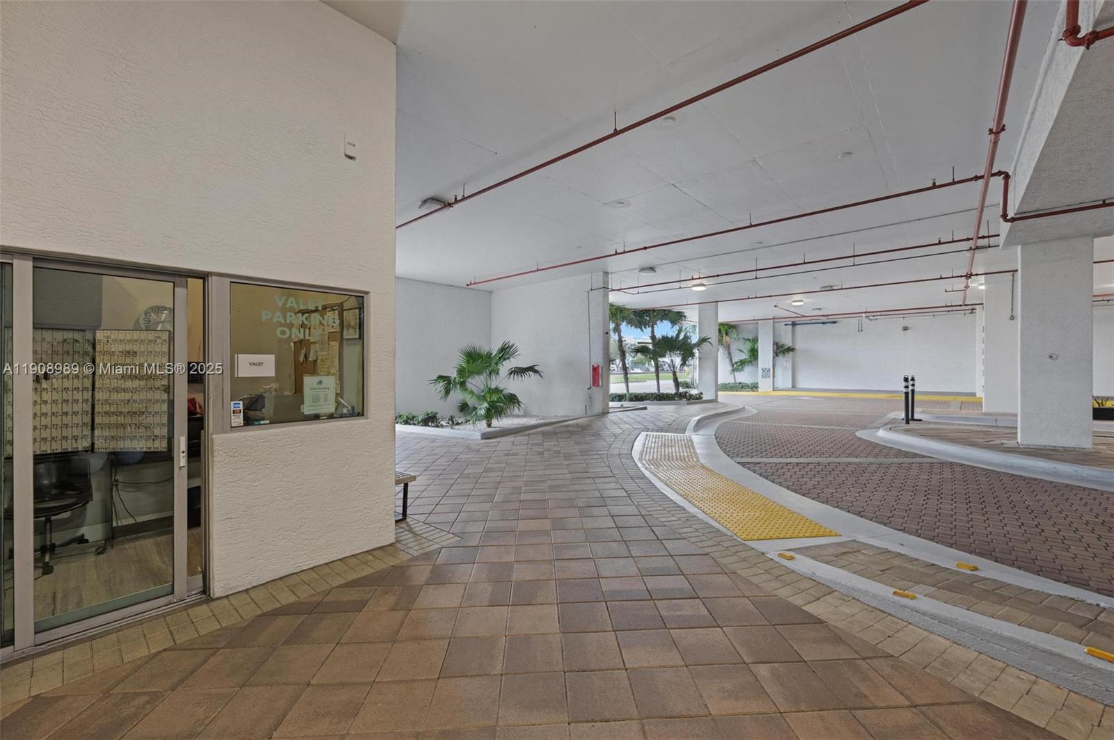 140 South Dixie Highway, Unit 533 Hollywood, FL 33020 - Photo 13 of 17 a view of a kitchen with a sink and a living room