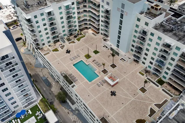 an aerial view of a multi story parking building