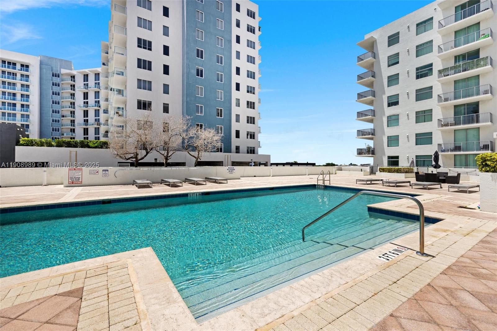 140 South Dixie Highway, Unit 533 Hollywood, FL 33020 - Photo 17 of 17 a swimming pool with outdoor seating and yard