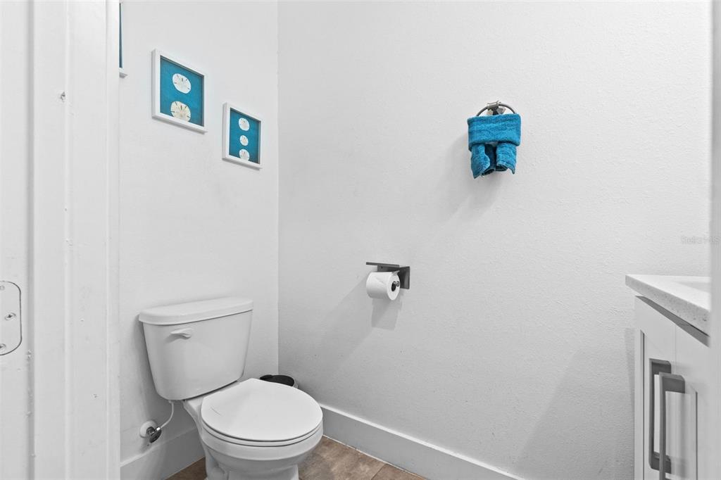 716 Laurel Avenue Venice, FL 34285 - Photo 13 of 42 a white toilet sitting next to a white wall