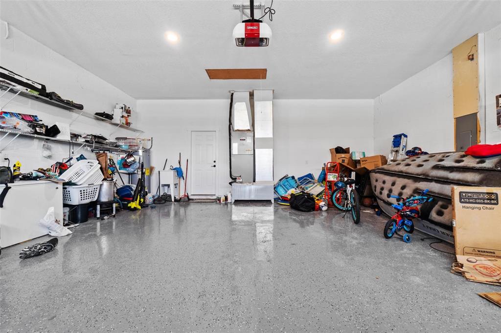 716 Laurel Avenue Venice, FL 34285 - Photo 15 of 42 a view of a garage with a bike and white walls