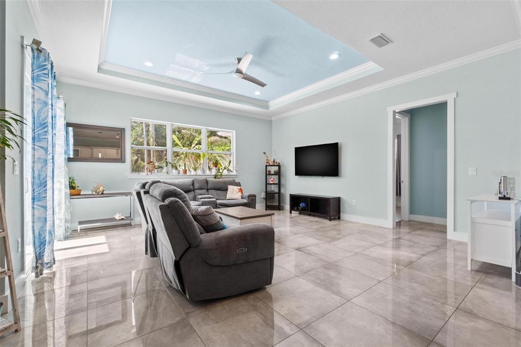 716 Laurel Avenue Venice, FL 34285 - Photo 16 of 42 a living room with furniture and a flat screen tv