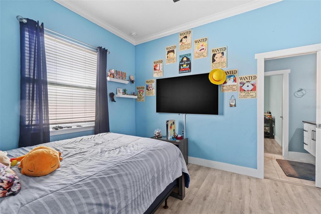 716 Laurel Avenue Venice, FL 34285 - Photo 23 of 42 a bedroom with a bed and flat screen tv