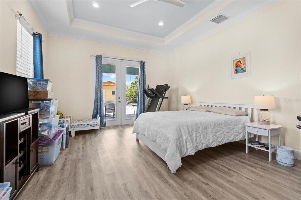 716 Laurel Avenue Venice, FL 34285 - Photo 32 of 42 a bedroom with a bed and a flat screen tv