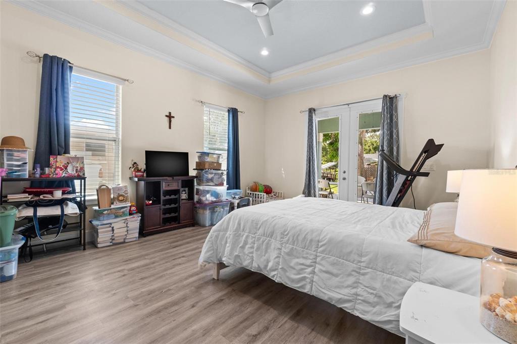 716 Laurel Avenue Venice, FL 34285 - Photo 34 of 42 a bedroom with a bed and a flat screen tv