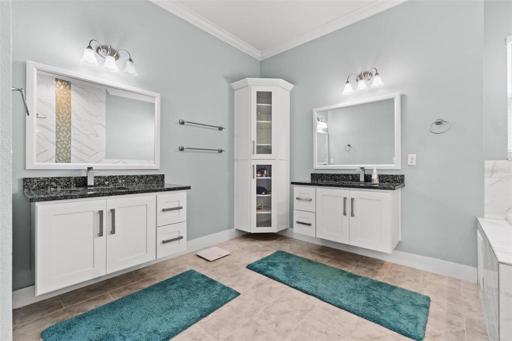 716 Laurel Avenue Venice, FL 34285 - Photo 35 of 42 a kitchen with a refrigerator and white cabinets