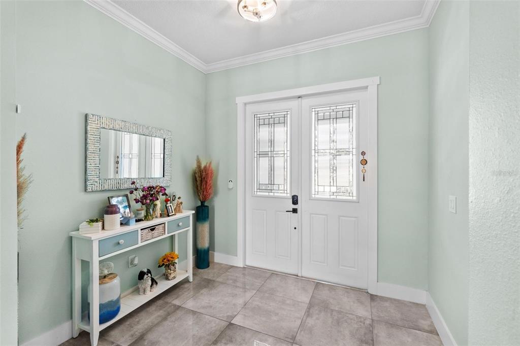 716 Laurel Avenue Venice, FL 34285 - Photo 5 of 42 a room with a baby crib dryer and washer