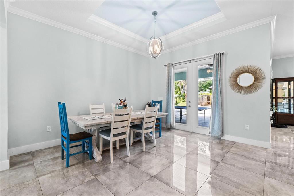 716 Laurel Avenue Venice, FL 34285 - Photo 7 of 42 a view of a dining room with furniture and a chandelier