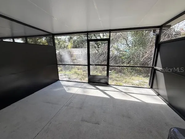 a view of a room with a large window