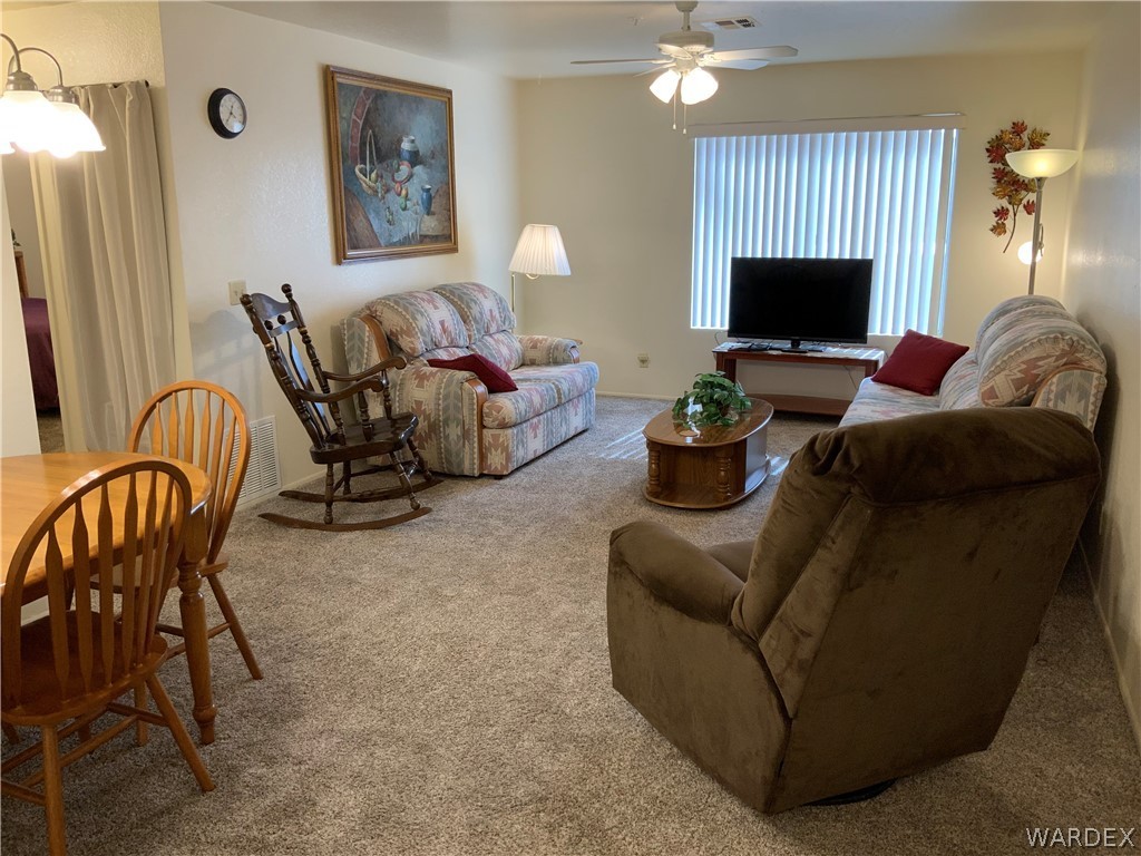 2052 Mesquite Lane, Unit 101 Laughlin, NV 89029 - Photo 13 of 32 a living room with furniture and a flat screen tv