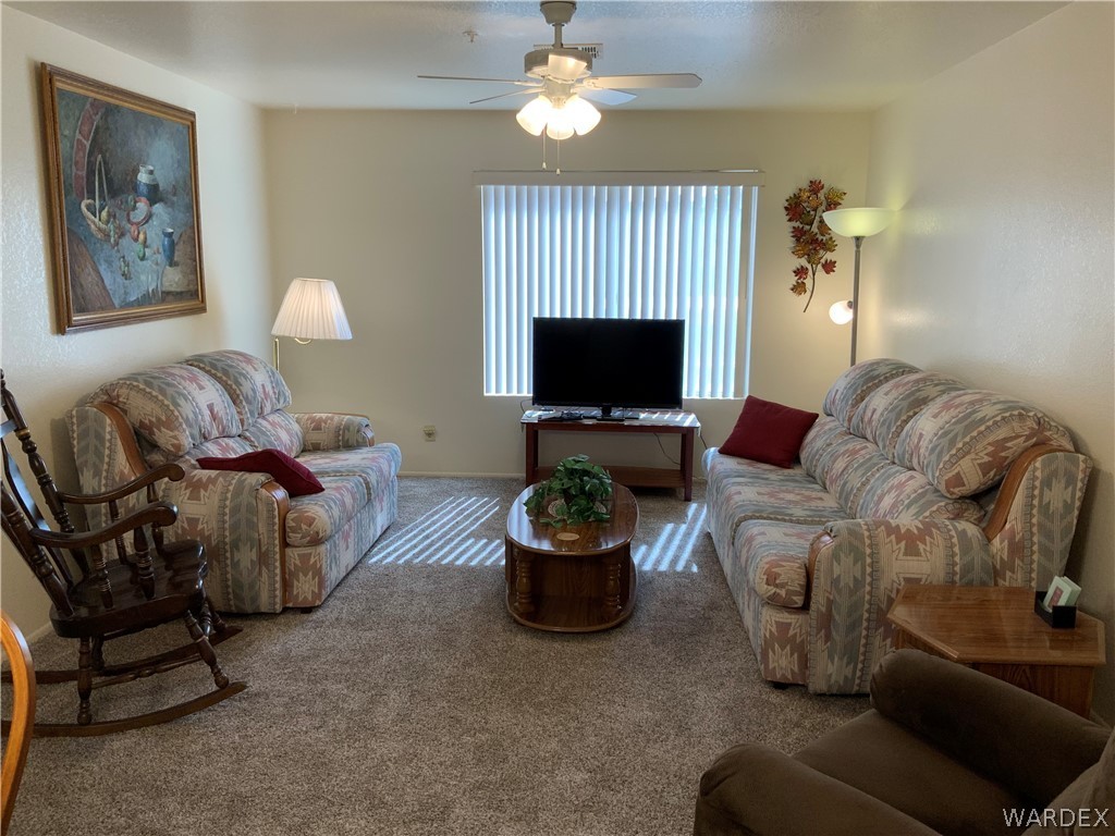 2052 Mesquite Lane, Unit 101 Laughlin, NV 89029 - Photo 14 of 32 a living room with furniture and a flat screen tv