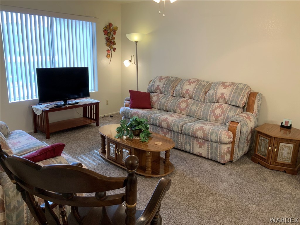 2052 Mesquite Lane, Unit 101 Laughlin, NV 89029 - Photo 17 of 32 a living room with furniture and a flat screen tv