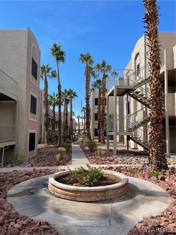 2052 Mesquite Lane, Unit 101 Laughlin, NV 89029 - Photo 2 of 32 a building with trees in front of it