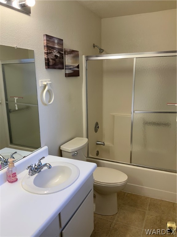 2052 Mesquite Lane, Unit 101 Laughlin, NV 89029 - Photo 22 of 32 a bathroom with a sink a toilet and shower
