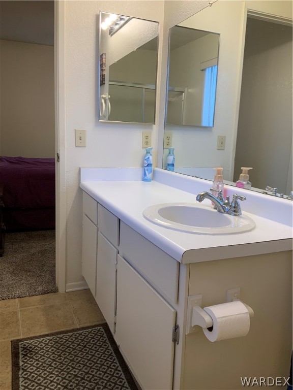 2052 Mesquite Lane, Unit 101 Laughlin, NV 89029 - Photo 23 of 32 a bathroom with a sink and a mirror