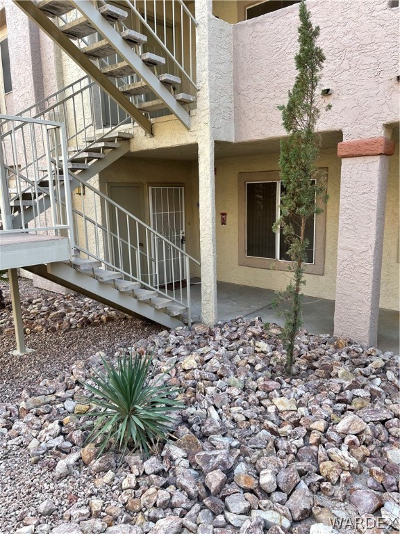 2052 Mesquite Lane, Unit 101 Laughlin, NV 89029 - Photo 3 of 32 front view of a house with a bench