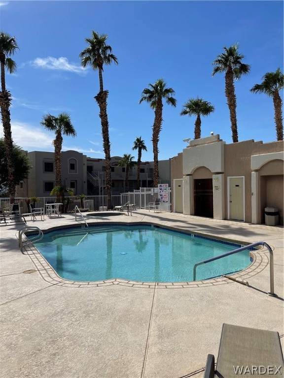 2052 Mesquite Lane, Unit 101 Laughlin, NV 89029 - Photo 31 of 32 a view of a house with swimming pool