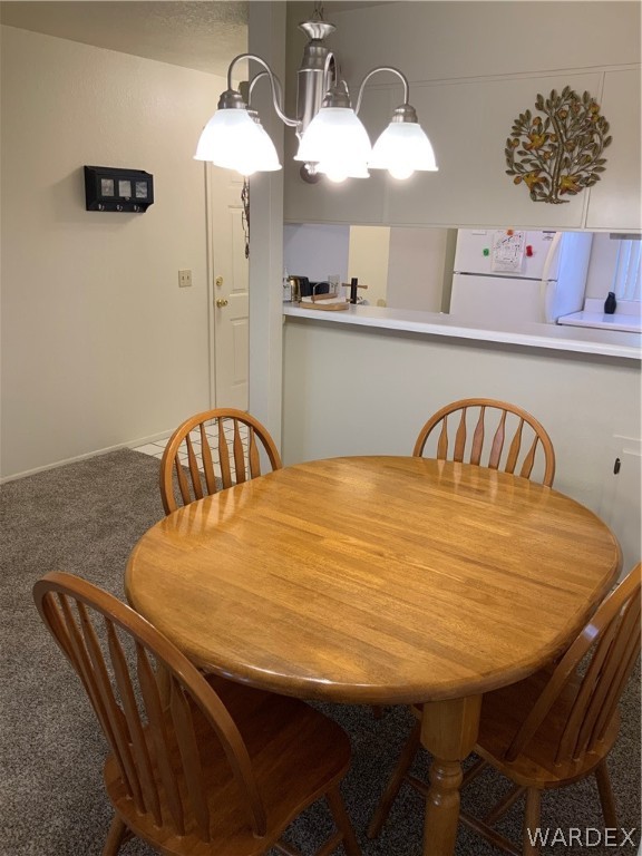 2052 Mesquite Lane, Unit 101 Laughlin, NV 89029 - Photo 10 of 32 a bedroom with a bed and a chandelier