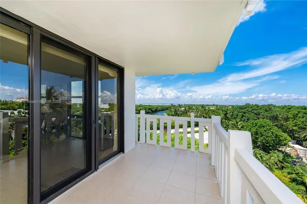 a view of a balcony with furniture