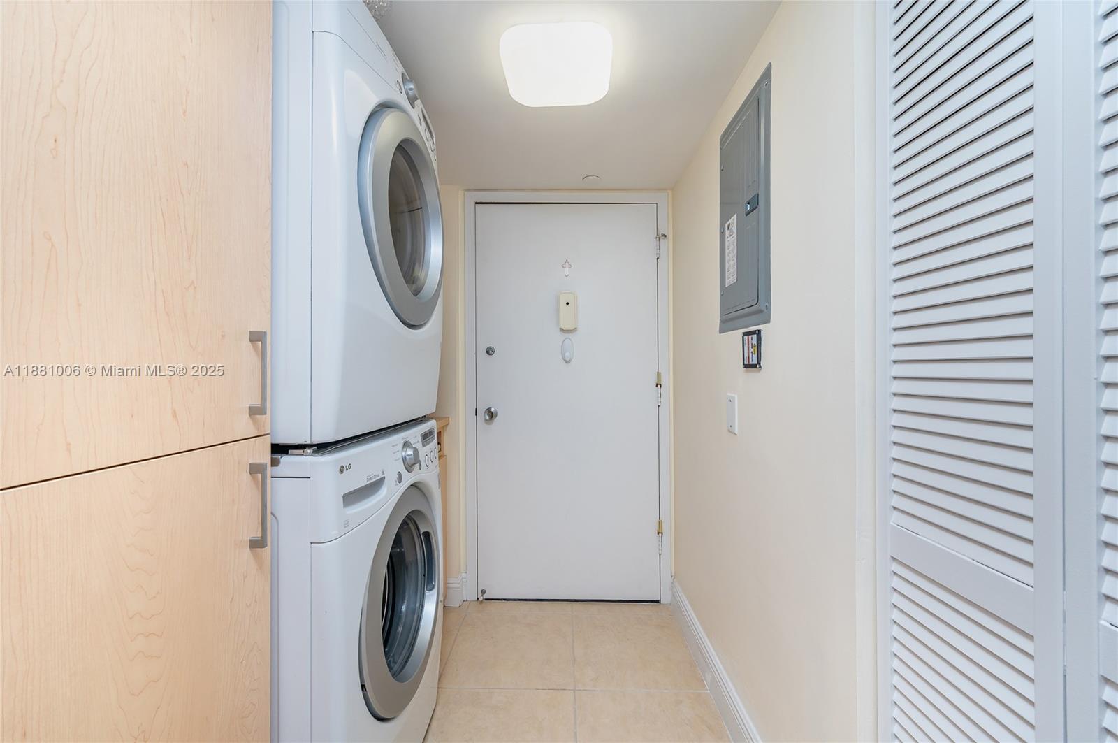 1121 Crandon Boulevard, Unit E501 Key Biscayne, FL 33149 - Photo 15 of 44 a utility room with dryer and washer