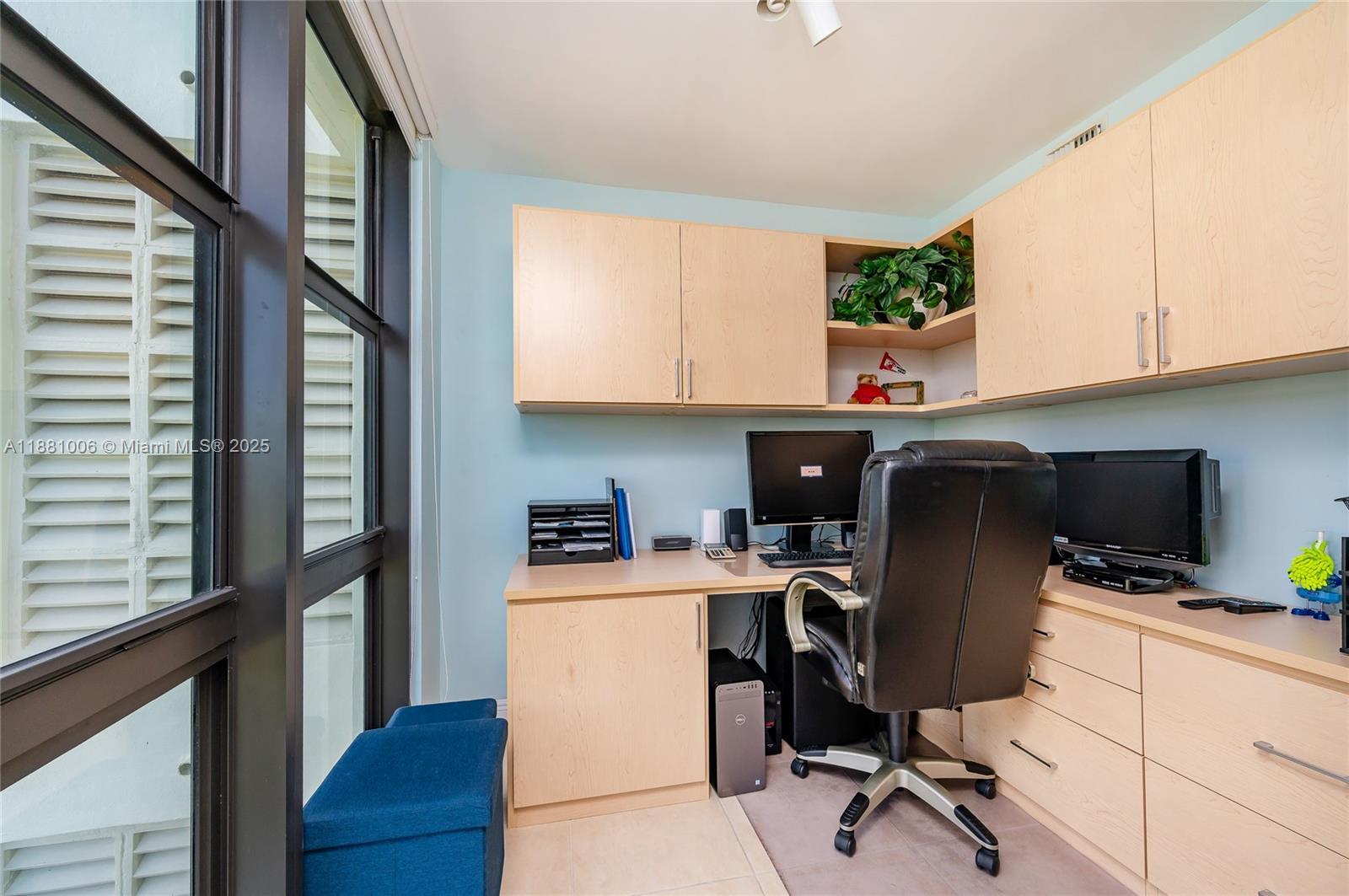 1121 Crandon Boulevard, Unit E501 Key Biscayne, FL 33149 - Photo 16 of 44 a view of workspace with wooden floor windows