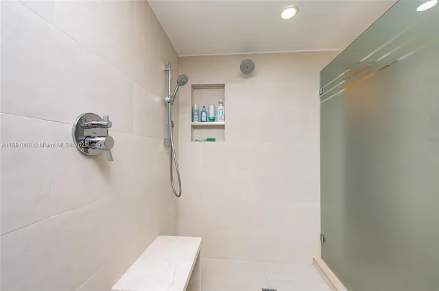 a bathroom with a sink vanity and a mirror