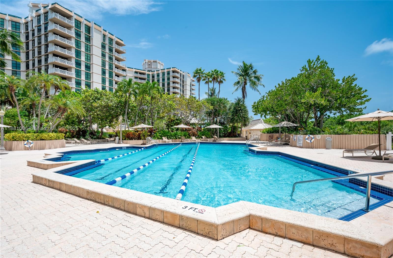1121 Crandon Boulevard, Unit E501 Key Biscayne, FL 33149 - Photo 29 of 44 a view of a swimming pool with a patio