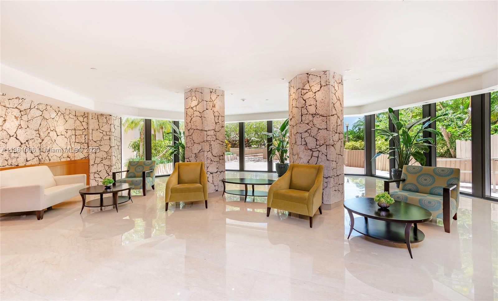 1121 Crandon Boulevard, Unit E501 Key Biscayne, FL 33149 - Photo 34 of 44 a living room with furniture and a large window