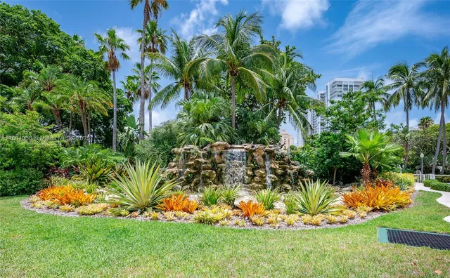 a view of a swimming pool with an outdoor space and seating area