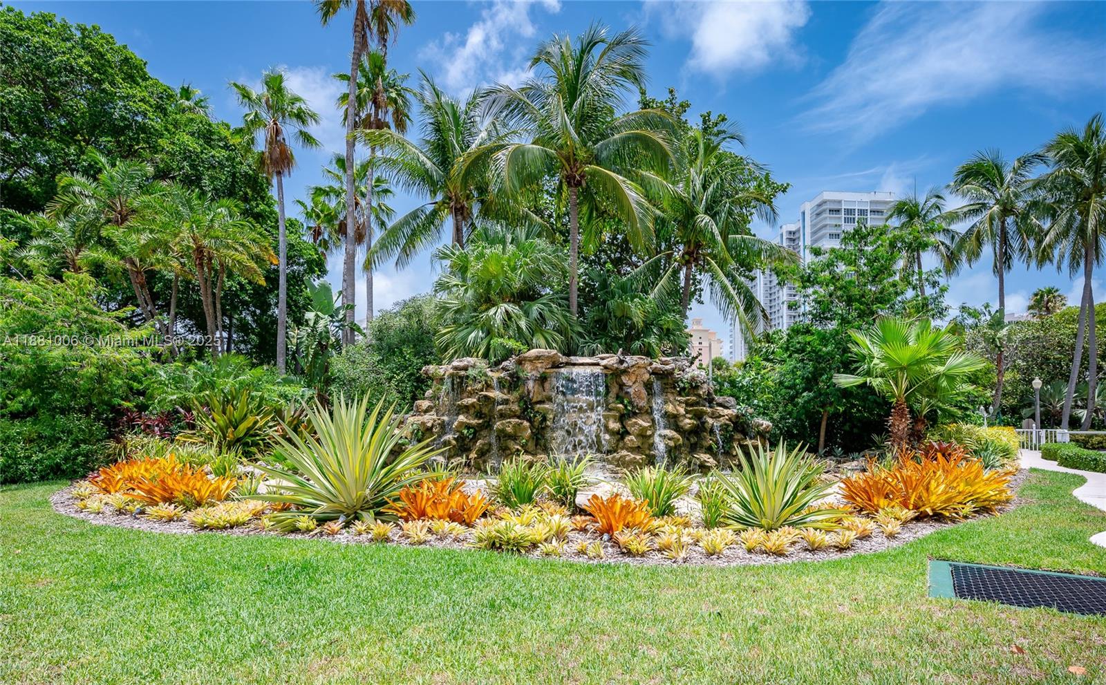 1121 Crandon Boulevard, Unit E501 Key Biscayne, FL 33149 - Photo 39 of 44 a view of a palm tree in a yard