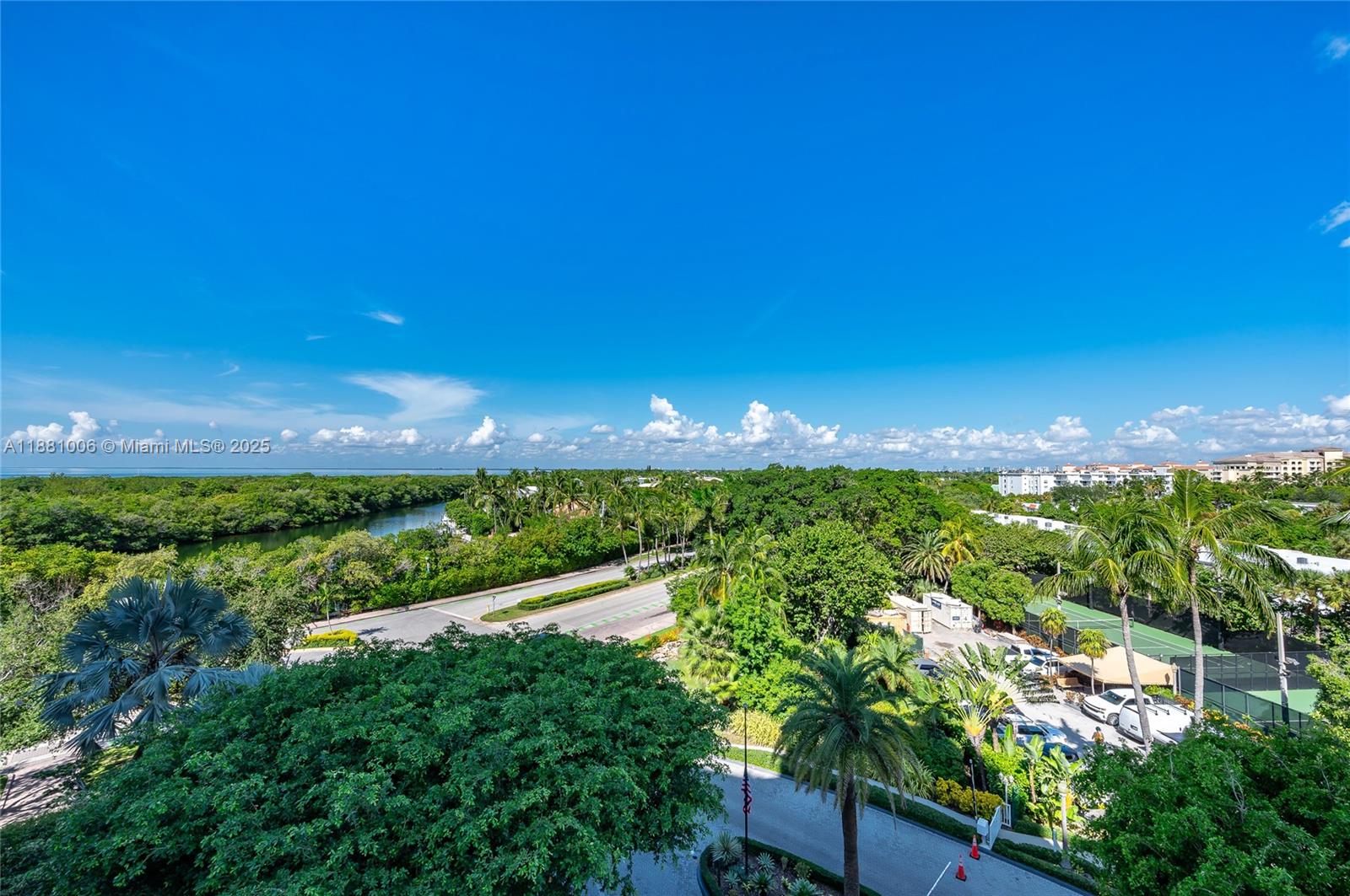 1121 Crandon Boulevard, Unit E501 Key Biscayne, FL 33149 - Photo 42 of 44 a view of a lake and a yard