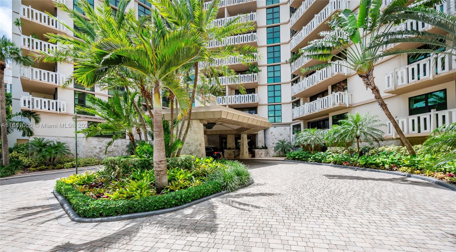 1121 Crandon Boulevard, Unit E501 Key Biscayne, FL 33149 - Photo 43 of 44 a view of a building with garden and plants