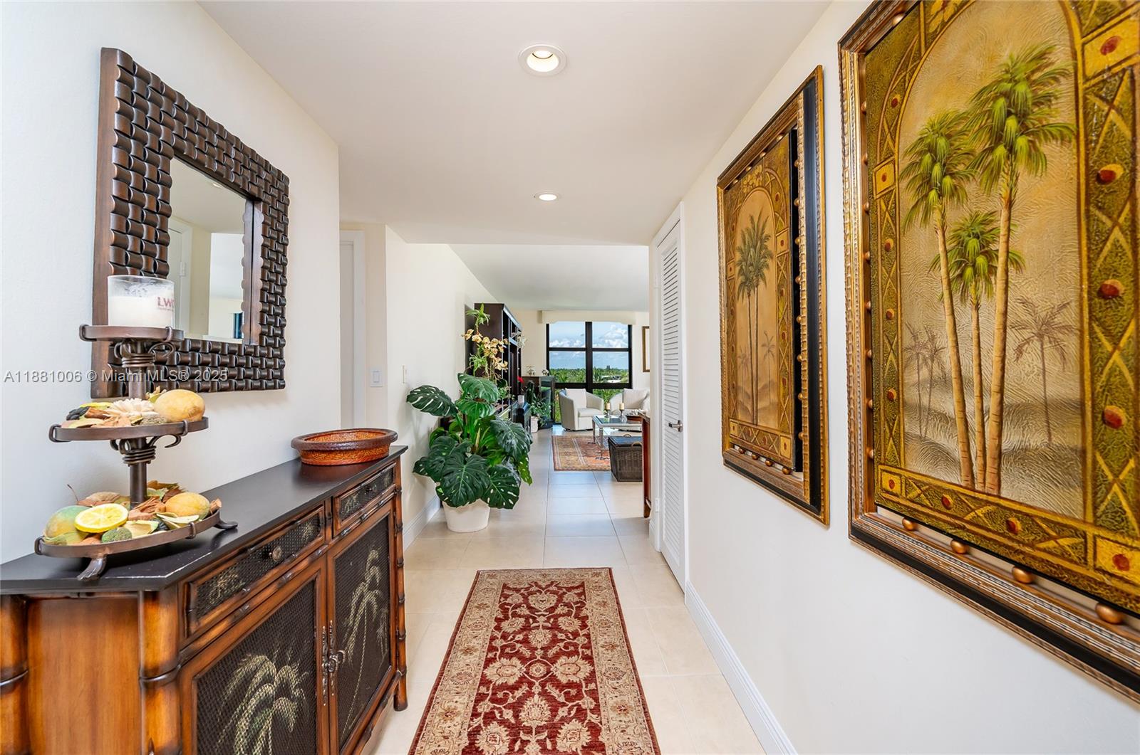 1121 Crandon Boulevard, Unit E501 Key Biscayne, FL 33149 - Photo 5 of 44 a hallway with a potted plant on the front of it