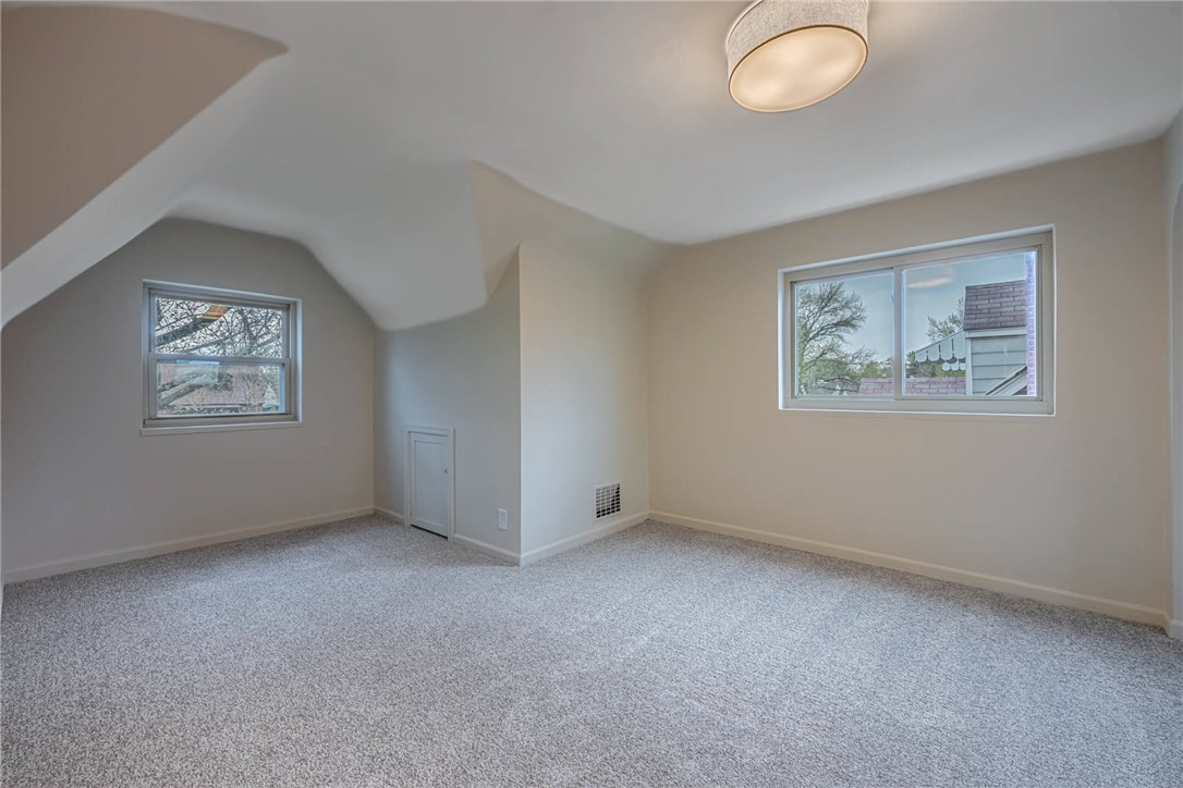 1012 Hampshire Road Dayton, OH 45419 - Photo 25 of 39 This bright room features sloped ceilings and ample natural light from two windows.
