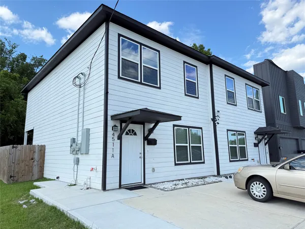 a car parked in front of a house