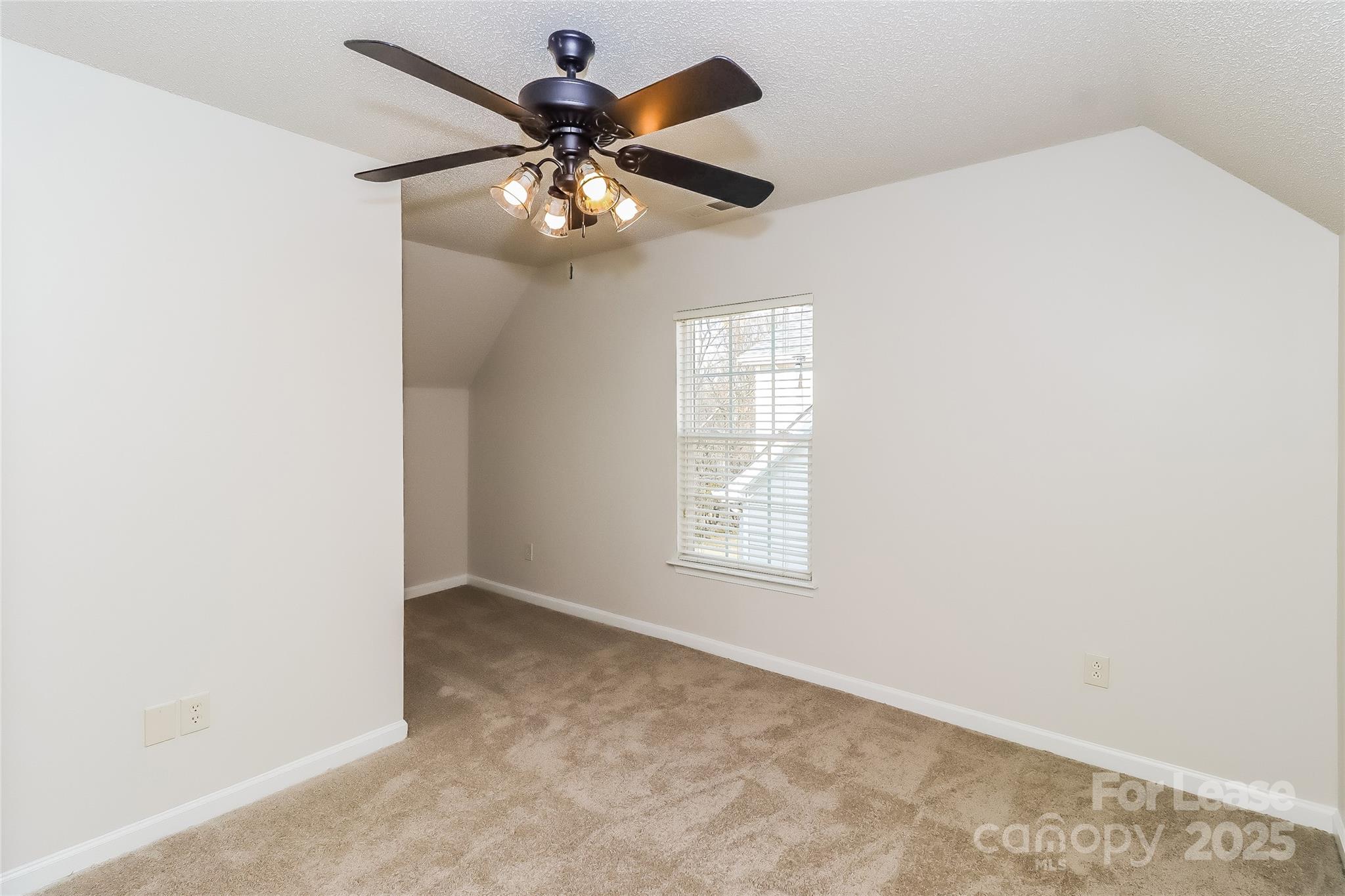 2032 Pimpernel Road Charlotte, NC 28213 - Photo 11 of 17 an empty room with windows and fan