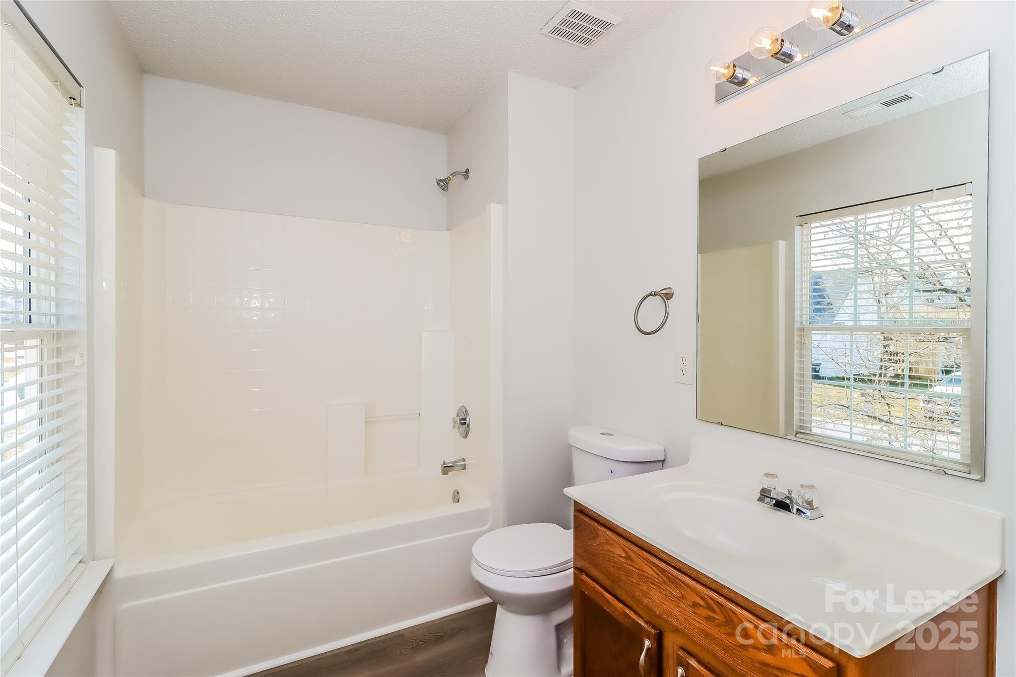 2032 Pimpernel Road Charlotte, NC 28213 - Photo 12 of 17 a bathroom with a sink a toilet and shower