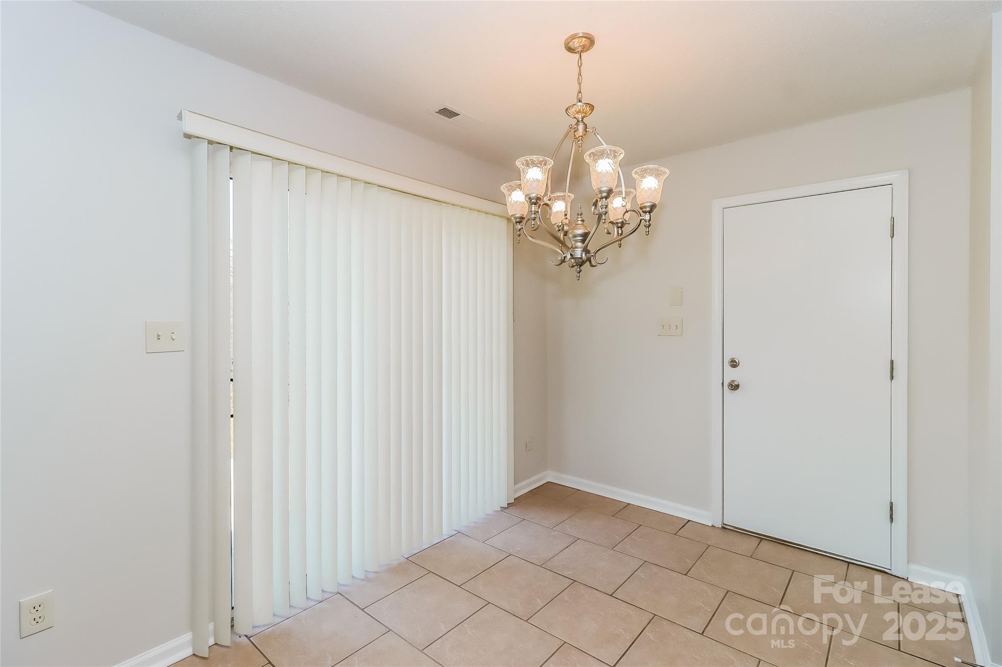 2032 Pimpernel Road Charlotte, NC 28213 - Photo 6 of 17 a view of a chandelier in a room