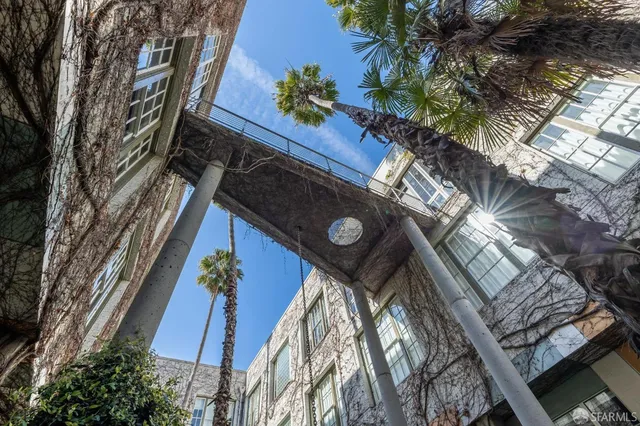 a view of a house with a tree