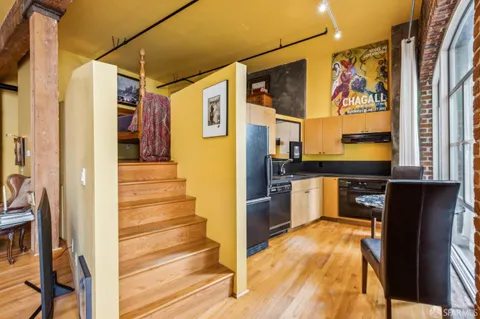 a view of a kitchen with a stove and a refrigerator