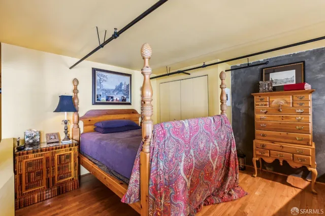 a bedroom with a bed and a closet