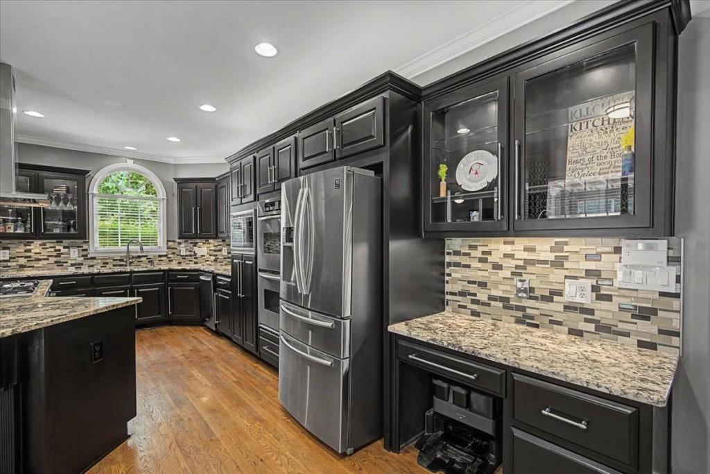 122 Ridge View Drive Ball Ground, GA 30107 - Photo 23 of 84 a kitchen with granite countertop stainless steel appliances and wooden cabinets