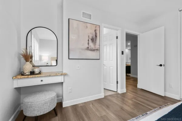 a view of bathroom with a sink and a mirror